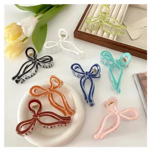 Detailed flat lay of colorful jelly-textured bow hair clips on a stylish vanity setup