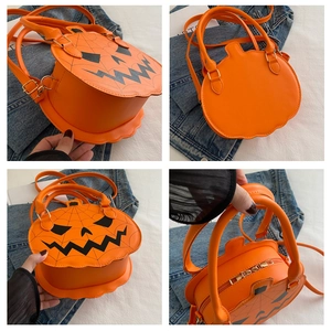 Detailed views of the pumpkin-shaped orange crossbody bag with a black jack-o'-lantern face