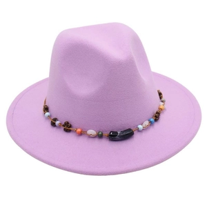 Close-up of lavender wool felt fedora featuring ethnic beaded band and floral charms