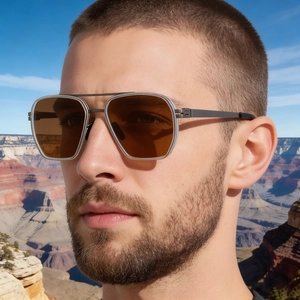Close-up of pilot polarized sunglasses with brown lenses and gunmetal frame on a model