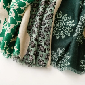 Close-up of soft floral pattern and tassels on printed cotton linen pashmina scarf