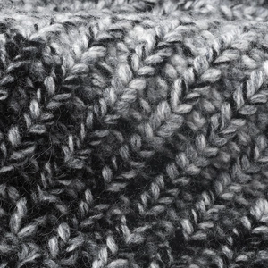 Thick wool knit bucket hat featuring a black and white mélange textured weaving pattern