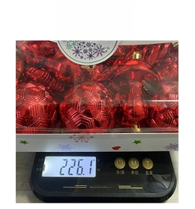 Macro detail of red 28pcs Christmas ball set with textured ornaments on a digital scale