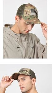 Detail of jungle camouflage baseball cap featuring breathable mesh and American flag patch