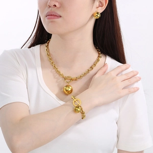 Polished gold ball jewelry set with chunky O-chain, necklace, bracelet, and earrings