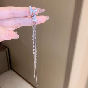 Elegant butterfly tassel ear cuff with rhinestones and pearls in a silver finish