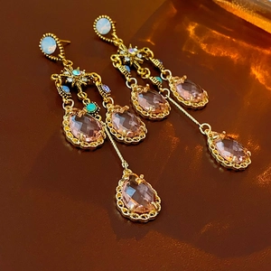 Vintage gold tassel earrings with amber crystal teardrops and pale blue opal accents