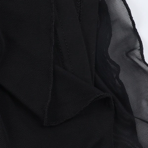 Detailed macro view showing the layered black mesh fabric and professional hem stitching
