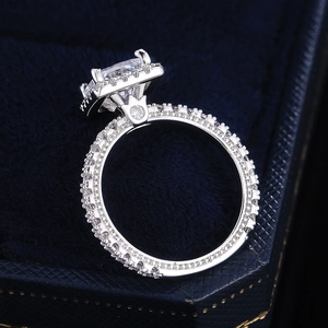 Close-up of a sparkling rectangular cut diamond engagement ring in a velvet box