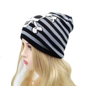 Knitted skull beanie with black and grey stripes for winter outdoor warmth on head model