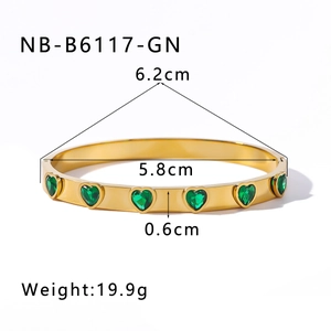 Detailed view of gold 18k plated bangle with green heart zircon and size measurements