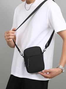 Men's black Oxford fabric crossbody bag with adjustable strap and casual aesthetic