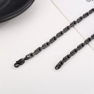 Detail of black plated stainless steel chain necklace with secure lobster clasp