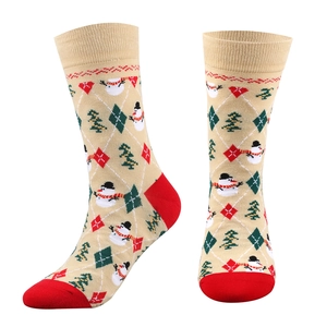 Detail of Christmas crew socks with snowman and tree patterns in Nordic knit style