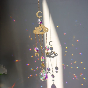 Detailed view of rainbow crystal suncatcher with golden moon and star metal accents