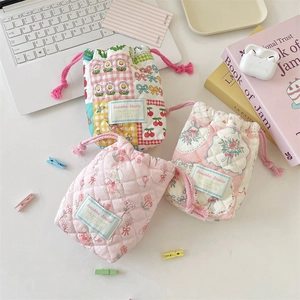 Quilted cotton drawstring camera storage pouch in floral and plaid patterns