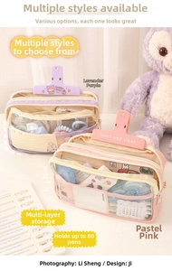 Three-layer clear pencil case in purple and pink showing large stationery storage capacity