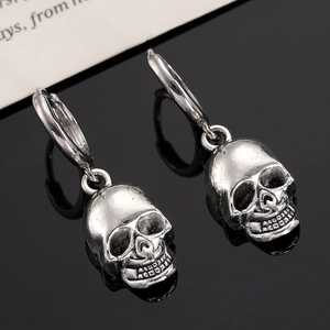 Silver skull hoop earrings for men and women with rock punk style on black mirror