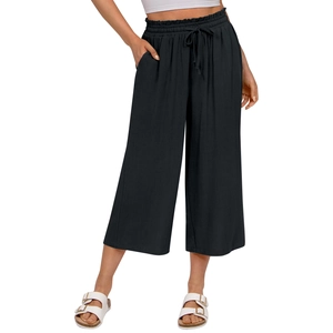 Detail of high waisted linen trousers with elastic drawstring waistband and side pockets
