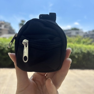 Mini backpack keychain pouch in black nylon with silver zipper for coins or earphones