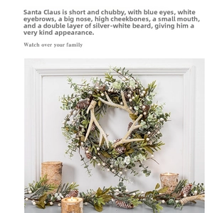 Close-up of a Christmas wreath with reindeer antlers and a pine cone garland