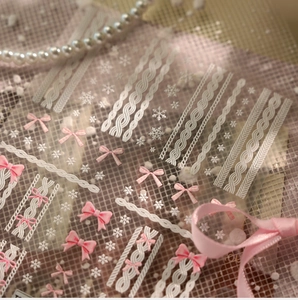 Detailed relief nail stickers with white knit textures and pink bow decorations