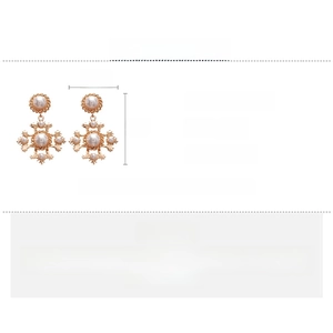 Detailed specs for vintage gold cross earrings with pearls measuring 7 by 4.6 centimeters