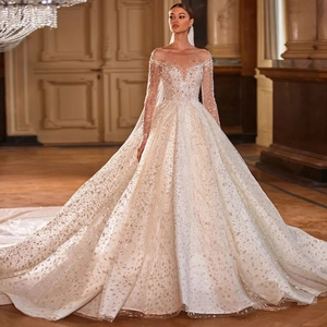 Luxurious champagne ball gown wedding dress with sequins and long cathedral train