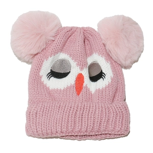 Close-up of pink knit baby hat with soft faux fur pom-poms and cartoon owl embroidery