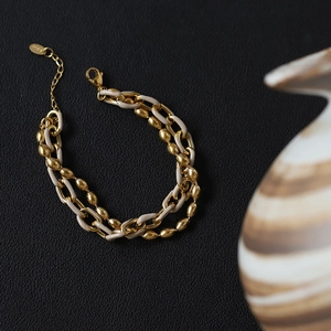 Bracelet double chaîne or et beige élégant avec étiquette gravée S925