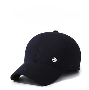 Detailed texture of thick wool blend fabric on a men's winter baseball cap with ear flaps