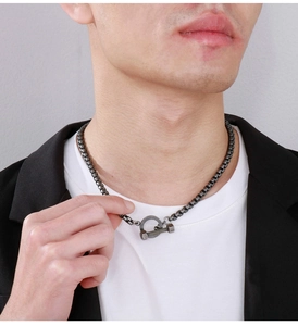 Detailed close-up of retro titanium steel box chain necklace with OT bolt clasp