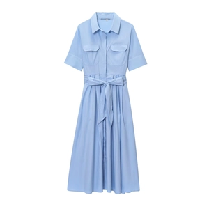 Detail of light blue short sleeve shirt dress with button collar and chest pockets