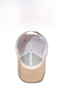 Detail of khaki baseball cap interior with sweatband, breathable fabric and adjustable strap