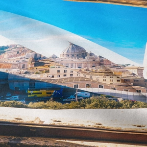 Macro shot of Roman cityscape print on tapestry fabric showing St. Peter's Basilica detail