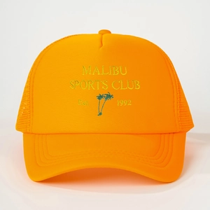 Detailed view of Malibu Sports Club embroidery and mesh texture on orange trucker hat