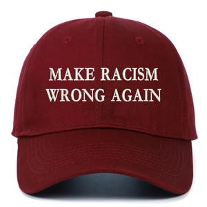 Close-up of white 3D embroidery on burgundy washed cotton baseball cap texture