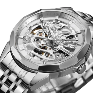 Macro detail of silver skeleton mechanical watch showing gears and polished steel