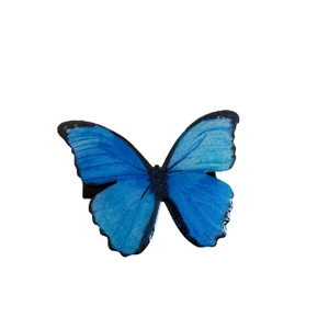 Sweet blue butterfly lace flower hair clip with glitter detail on a white background
