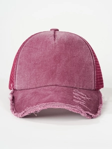 Close-up of distressed brim and breathable mesh on vintage washed trucker baseball cap