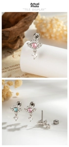 Macro detail of angel wing heart ear studs with screw back and cubic zirconia gems