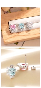 Detailed view of heart zircon screw-back studs in pink, light blue and white colors