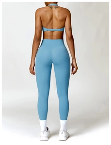 Rear view of light blue yoga set featuring V-shaped high-waisted leggings and racerback bra