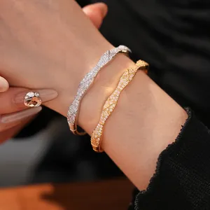 Luxury gold and silver plated crossover bangles with pave-set cubic zirconia for women