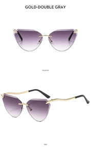 Detail view of gold-rimmed cat eye sunglasses with gradient purple lenses and metal legs