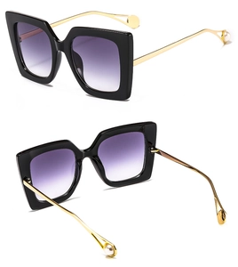Fashionable oversized square sunglasses with purple gradient lenses and pearl gold temples