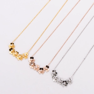 Exquisite clover pendant necklaces in gold, rose gold, and silver with inlaid diamonds