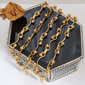 Gold plated chunky chain necklace with S-links and beads on black display box