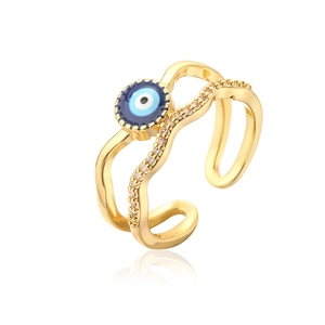 Detail of 18K gold-plated evil eye ring with blue enamel and pavé zircon stones