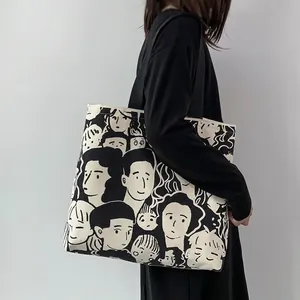 Borsa tote in tela minimalista con illustrazioni artistiche del viso e tracolle nere